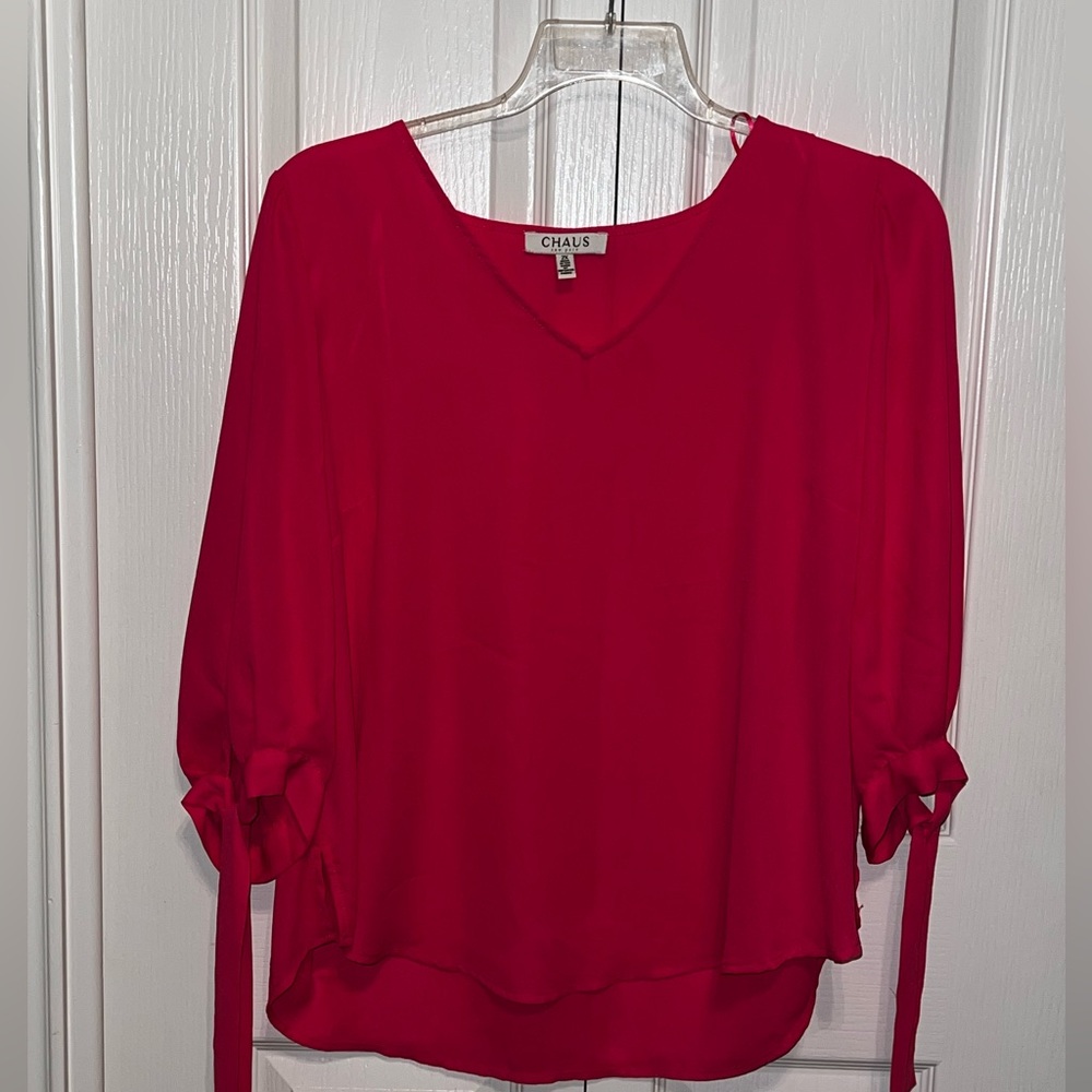 Pink quarter sleeves with ties on sleeves.